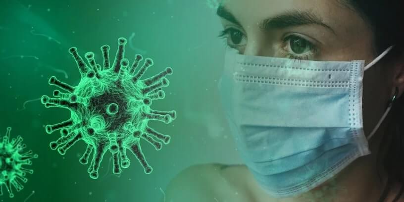 Illustration d'un virus et d'une femme portant un masque chirurgical.